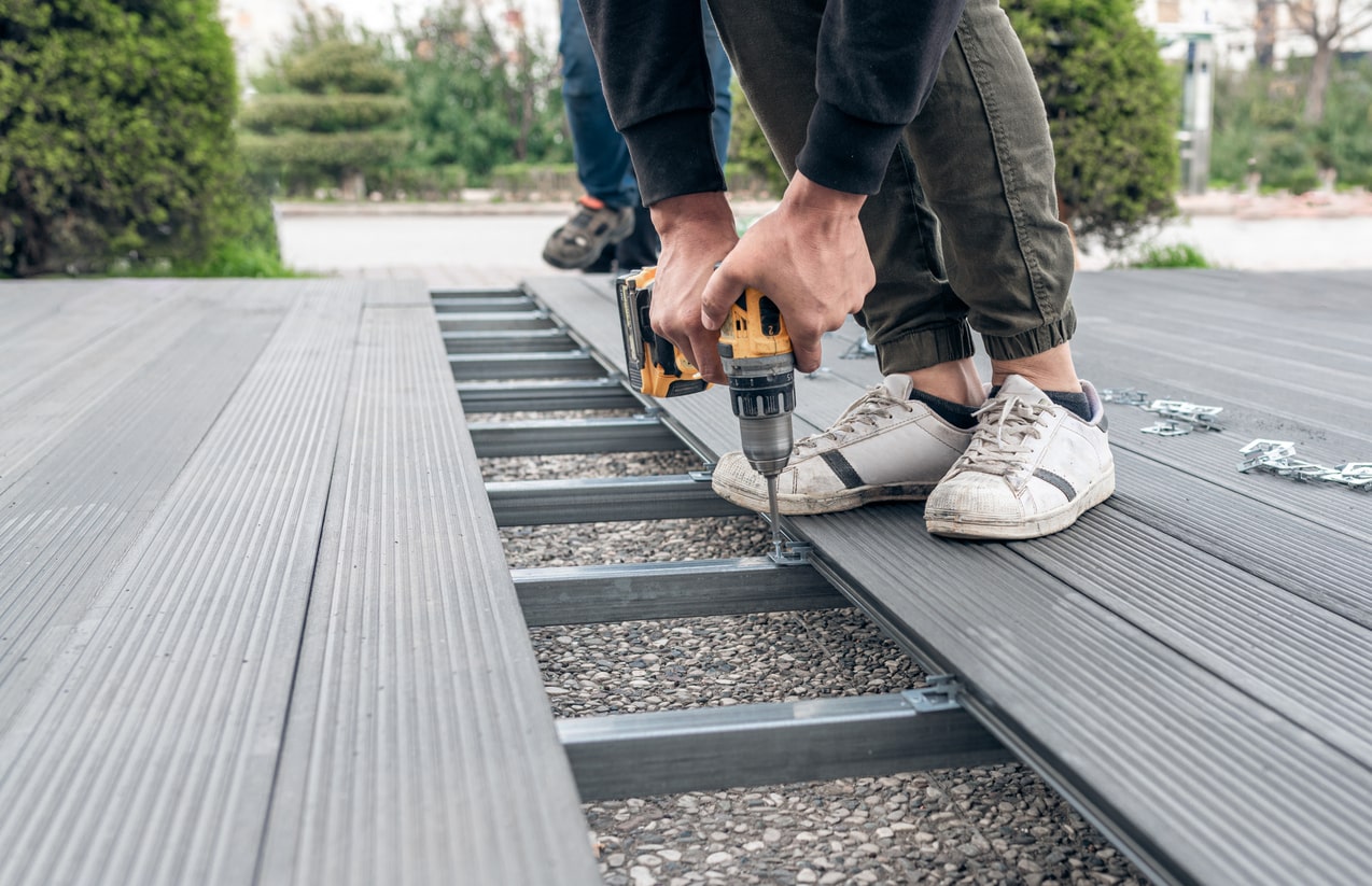 garden landscaper installing decking